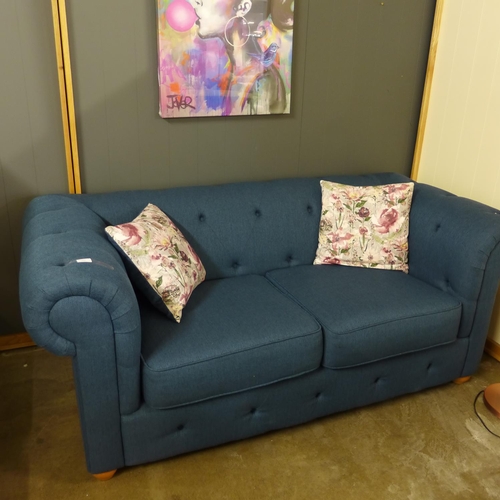 1364 - A navy blue textured weave Chesterfield style three seater sofa and two seater sofa and with floral ... 