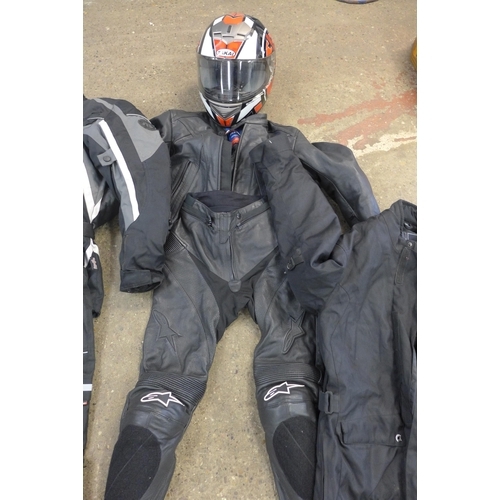 2331 - Box of motorbike jackets/suits with helmets, etc.