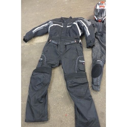 2331 - Box of motorbike jackets/suits with helmets, etc.