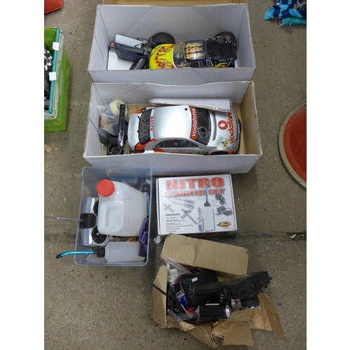 2086 - Two boxed petrol driven motor cars, controllers, fuel, kits, etc.
