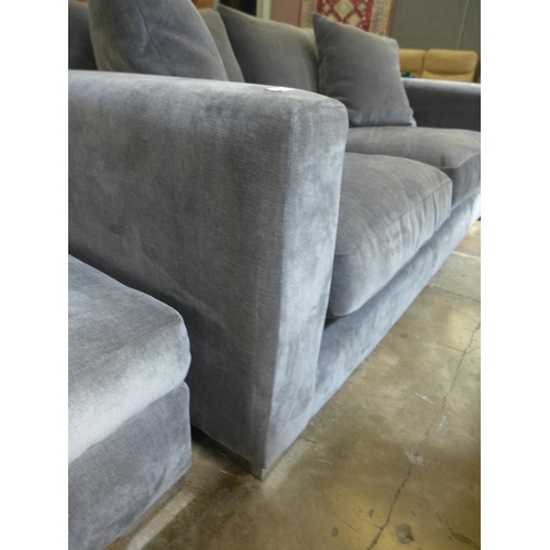 1340 - A fossil grey velvet three seater sofa and ottoman footstool