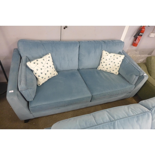 1346 - A diamond blue velvet three seater sofa with floral scatter cushions