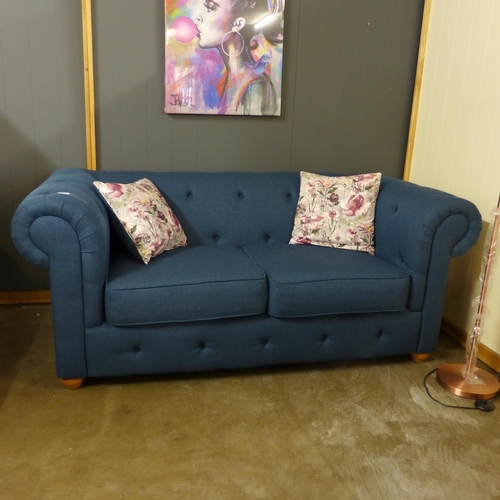 1366 - A navy blue textured weave Chesterfield style three seater sofa and two seater sofa and with floral ... 