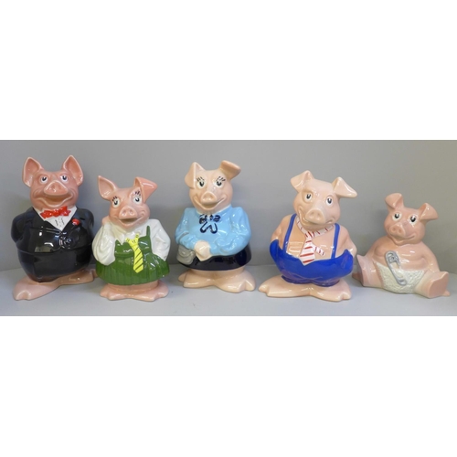 610 - A set of five Wade Nat West pig money banks, all with stoppers