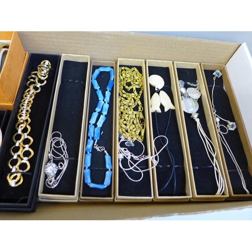 676 - A collection of costume bangles and bracelets, new in boxes