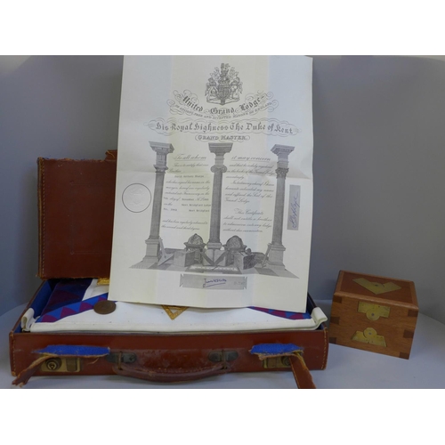 679 - A case of Masonic regalia and a bronze medal plus a Masonic box