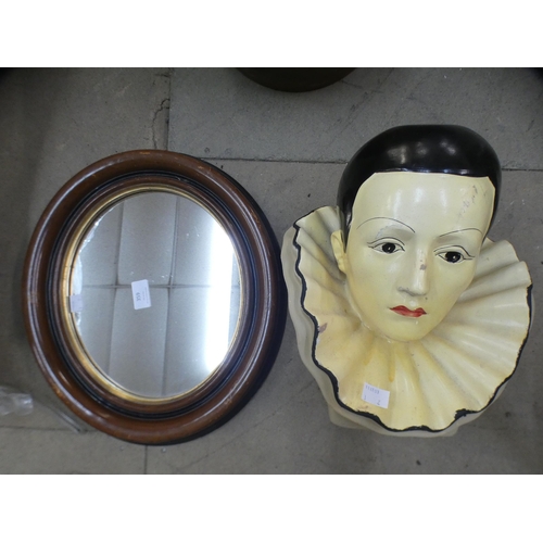 359 - A vintage plaster Pierrot clown mask and an oval mahogany framed mirror