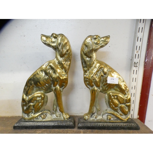 374 - A pair of Victorian cast iron and brass figural dog door stops