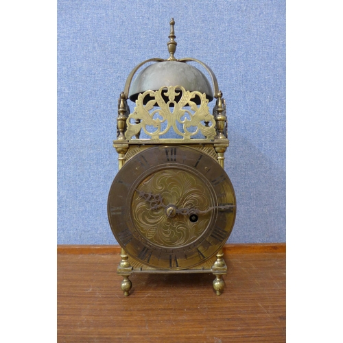 77 - An 18th Century style brass lantern clock