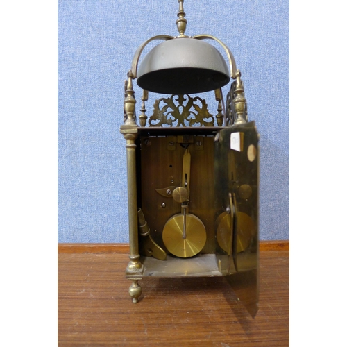 77 - An 18th Century style brass lantern clock