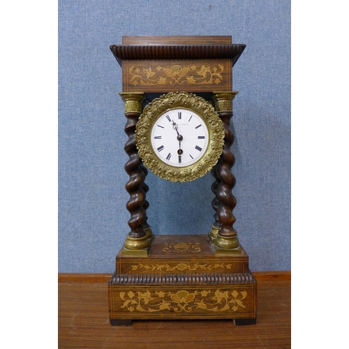 78 - A 19th Century French marquetry inlaid rosewood and parcel gilt portico clock