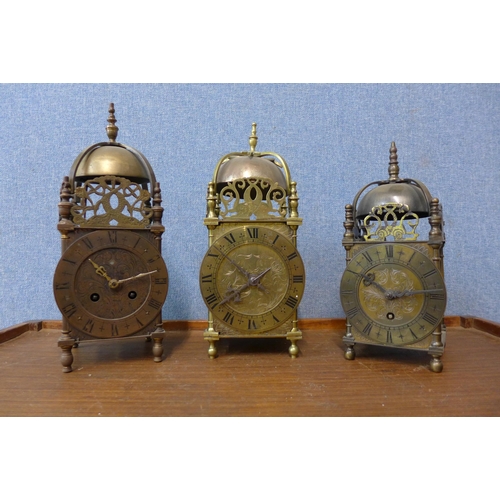 81 - Two French brass lantern clocks and one other