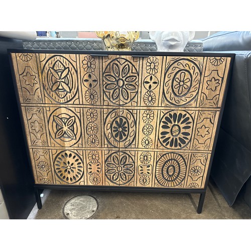 1472 - A black painted and wood two door bar cabinet with patterned front * this lot is subject to VAT