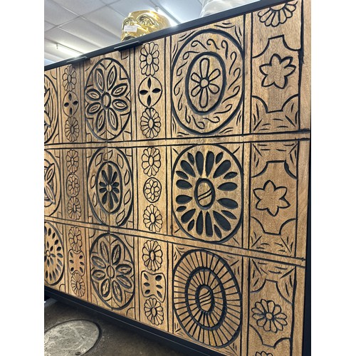 1472 - A black painted and wood two door bar cabinet with patterned front * this lot is subject to VAT