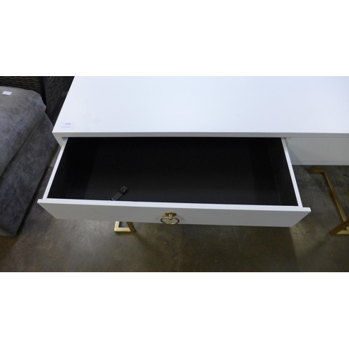 1438 - A white two drawer console table with gold legs