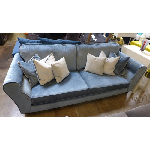 1316 - A diamond blue velvet upholstered four seater sofa