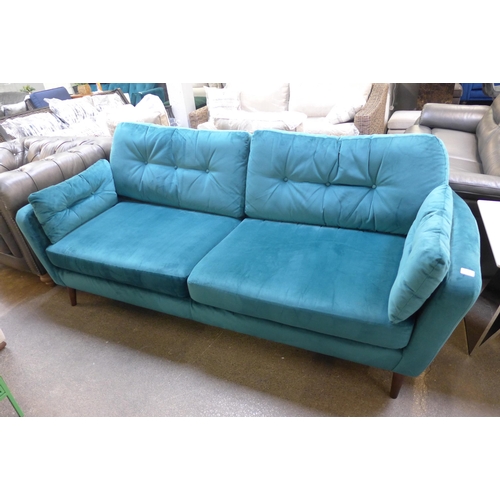 1371 - A teal velvet button backed four seater sofa