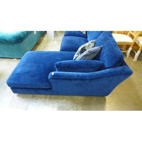 1379 - A deep blue velvet RHF corner sofa/chaise with patterned scatter cushions - damaged spring