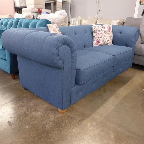 1442 - A navy blue textured weave Chesterfield style three seater sofa and loveseat