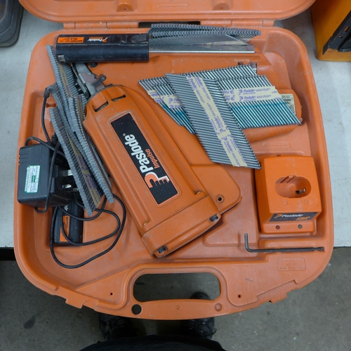 2027 - A Paslode nail gun two batteries, nails and gas canisters