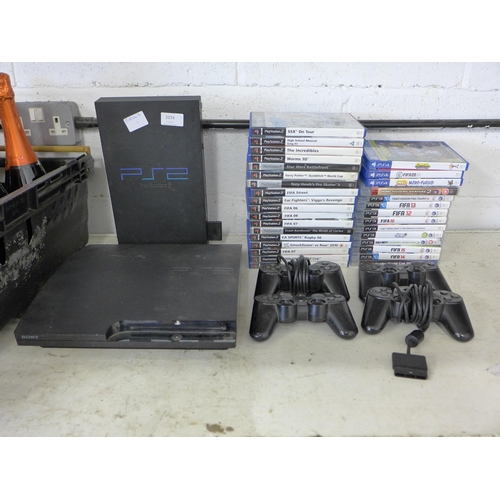 2074 - A Playstation 2 console and a Playstation 3 console with games, controllers and leads. W