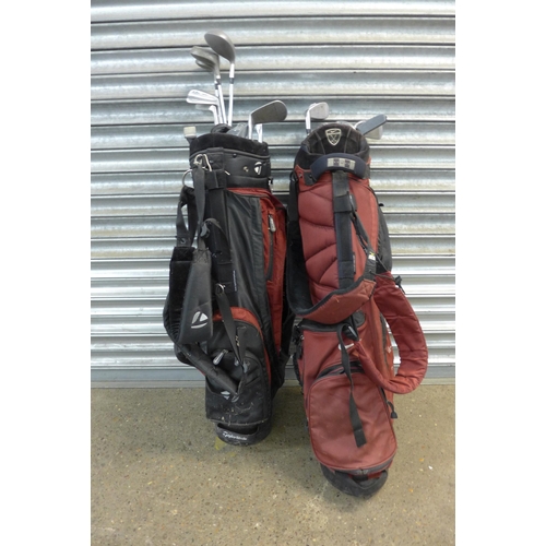 2214 - Two golf stand bags with a mixed quantity of irons/clubs