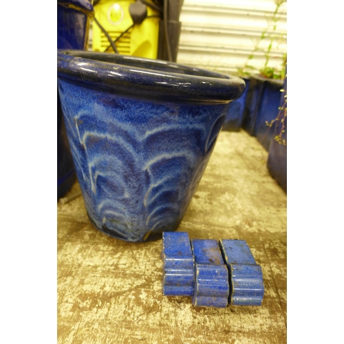 2221 - Four blue planters with feet