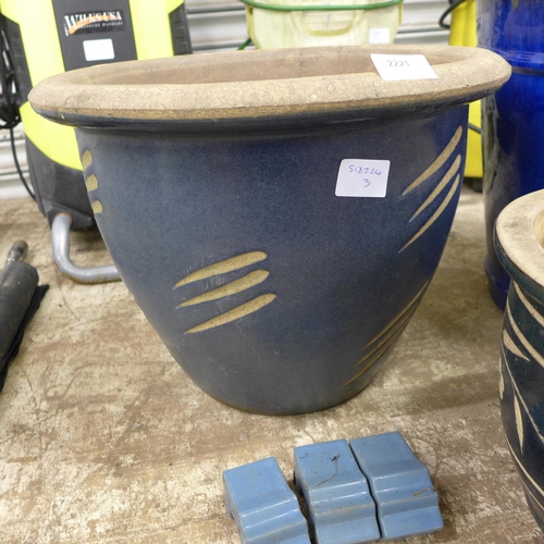 2221 - Four blue planters with feet