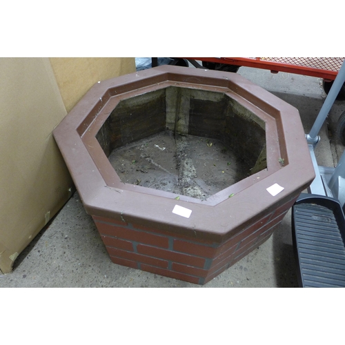 2244 - An octagonal fibreglass planter