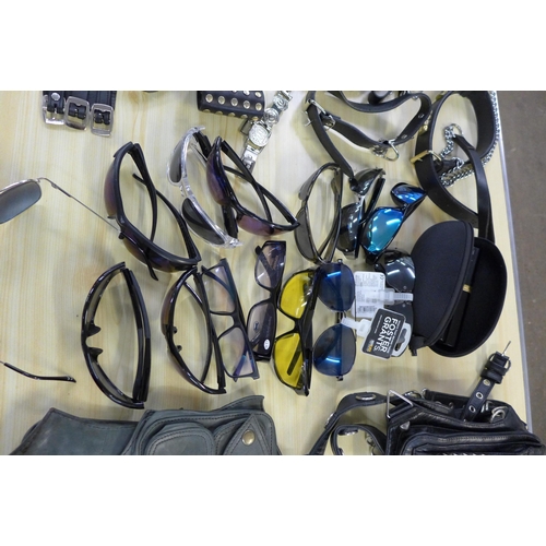 2253 - A box of leather belts, bags and sunglasses