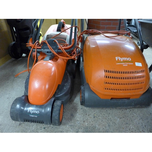 2293 - A Flymo Vision electric lawn rake and lawn mower