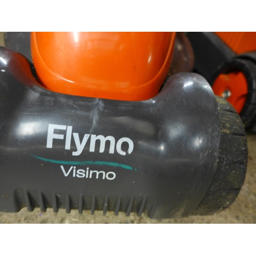 2293 - A Flymo Vision electric lawn rake and lawn mower