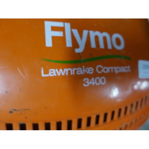 2293 - A Flymo Vision electric lawn rake and lawn mower