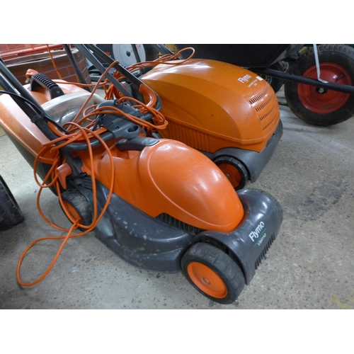 2293 - A Flymo Vision electric lawn rake and lawn mower