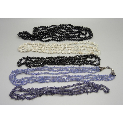 1011 - Five semi-precious stone necklaces including black agate, moonstone, black spinel and tanzanite