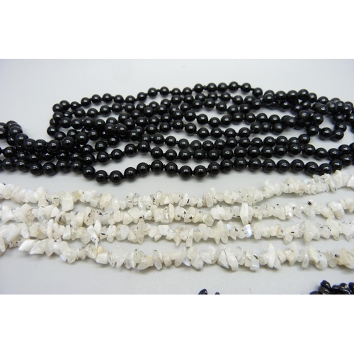 1011 - Five semi-precious stone necklaces including black agate, moonstone, black spinel and tanzanite