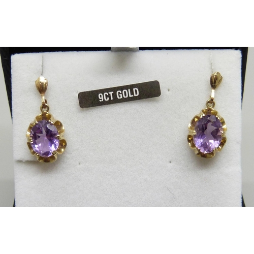 1033 - A pair of 9ct gold and amethyst drop earrings