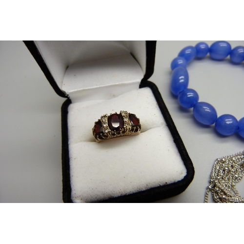 1051 - A 925 silver Links of London bracelet, a silver ring, a dress ring with blue stone and a bracelet