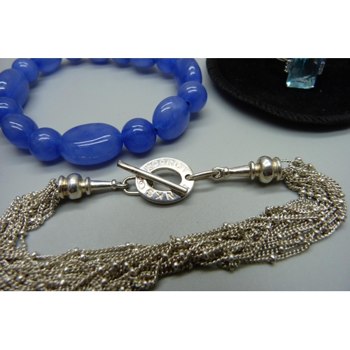 1051 - A 925 silver Links of London bracelet, a silver ring, a dress ring with blue stone and a bracelet