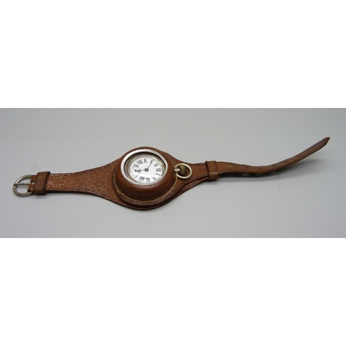 1065 - A silver cased fob watch in leather case/strap