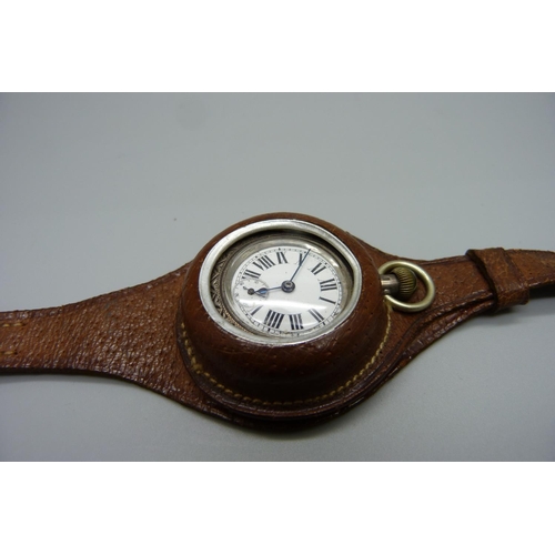 1065 - A silver cased fob watch in leather case/strap