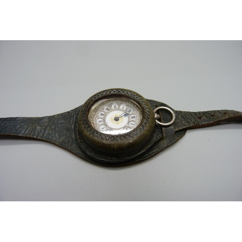 1066 - A silver cased fob watch in leather case/strap