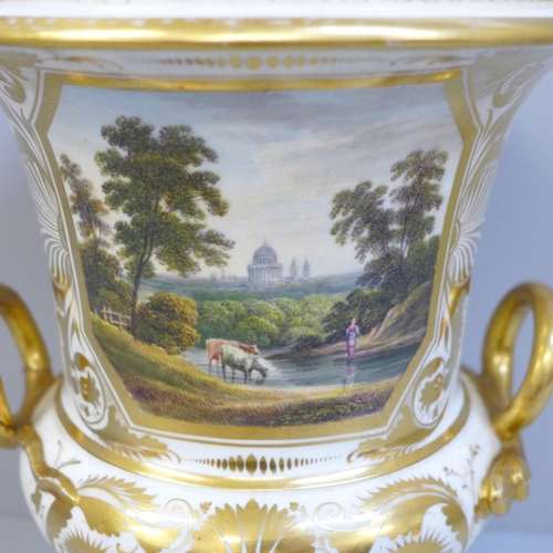 617 - A Derby porcelain campana 'In Italy' two handled vase with hand painted panel, one handle a/f