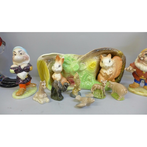 670 - A Murano glass clown, a glass model of a duck and dog, two Beswick seven dwarfs figures, Grumpy and ... 