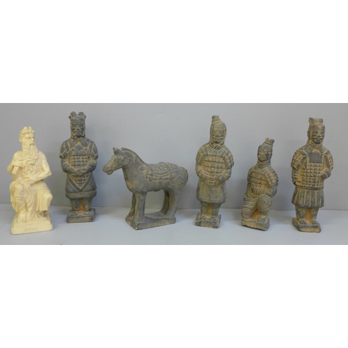 688 - Four Chinese models of terracotta warriors, horse and a resin figure of Moses