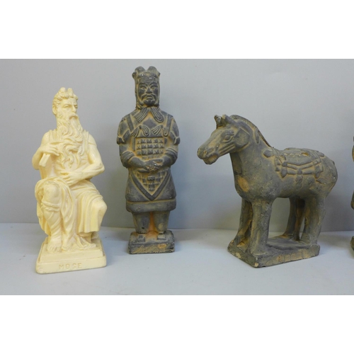 688 - Four Chinese models of terracotta warriors, horse and a resin figure of Moses