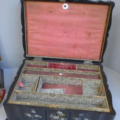 690 - An abalone decorated dressing table box, a carved wooden musical box and a crumb tray and brush