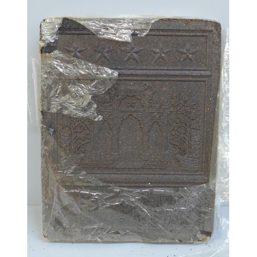 693 - A slab of Chinese pressed tea, 19cm x 24cm