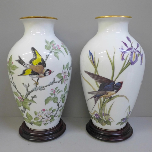 703 - A pair of Franklin Porcelain Woodland Bird and Meadowland Bird vases and two cloisonne vases