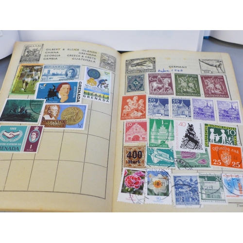 718 - Three stamp albums